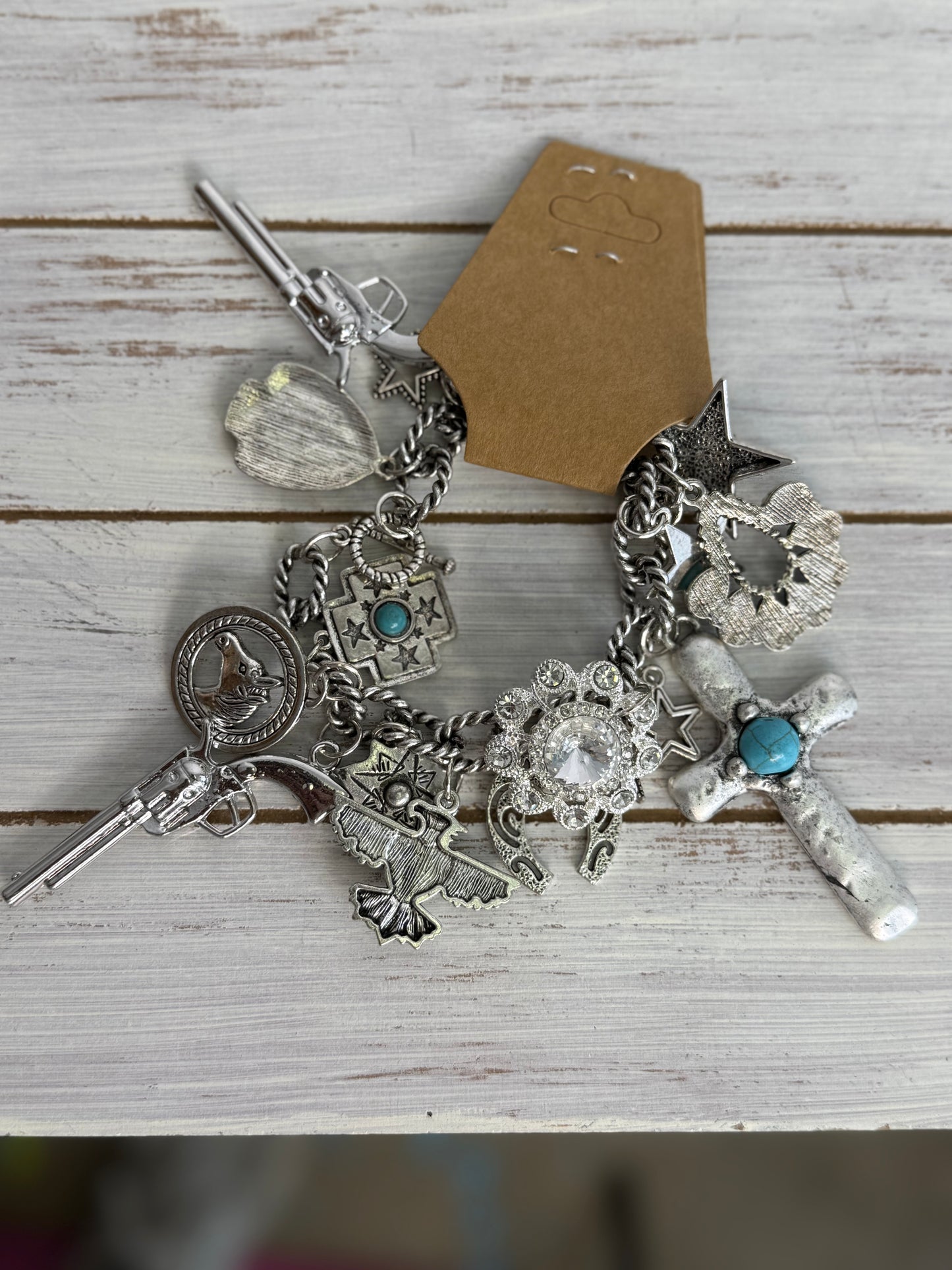A Rare Bird Gun Charm Bracelet