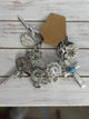 A Rare Bird Gun Charm Bracelet