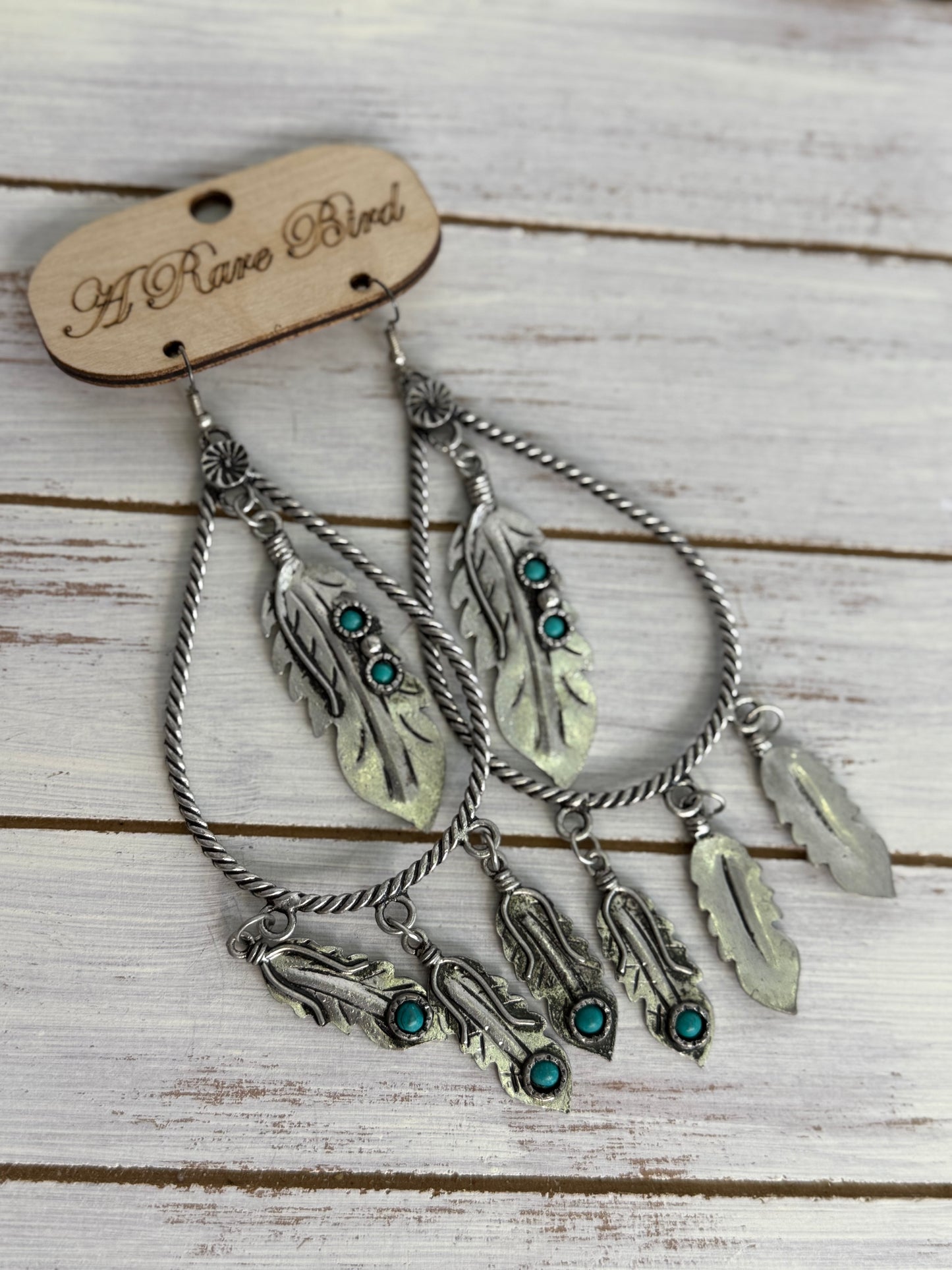 A Rare Bird Tear Drop Feather Earrings