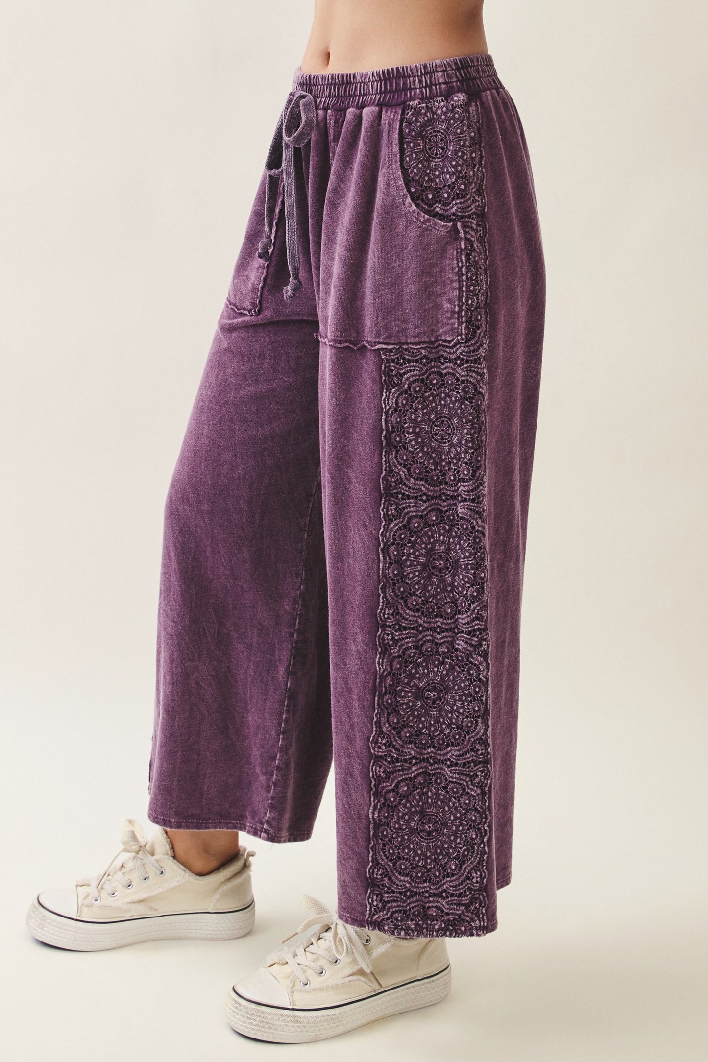 J.Her Mineral Washed Boho Trim Wide Leg Pants in eggplant - Side view showing full-length mandala lace embroidery panel and patch pocket