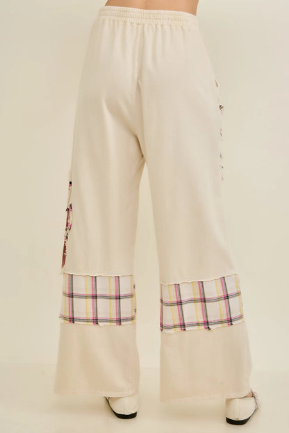 J.Her natural mineral washed flannel daisy pants back view with plaid panel hem detail