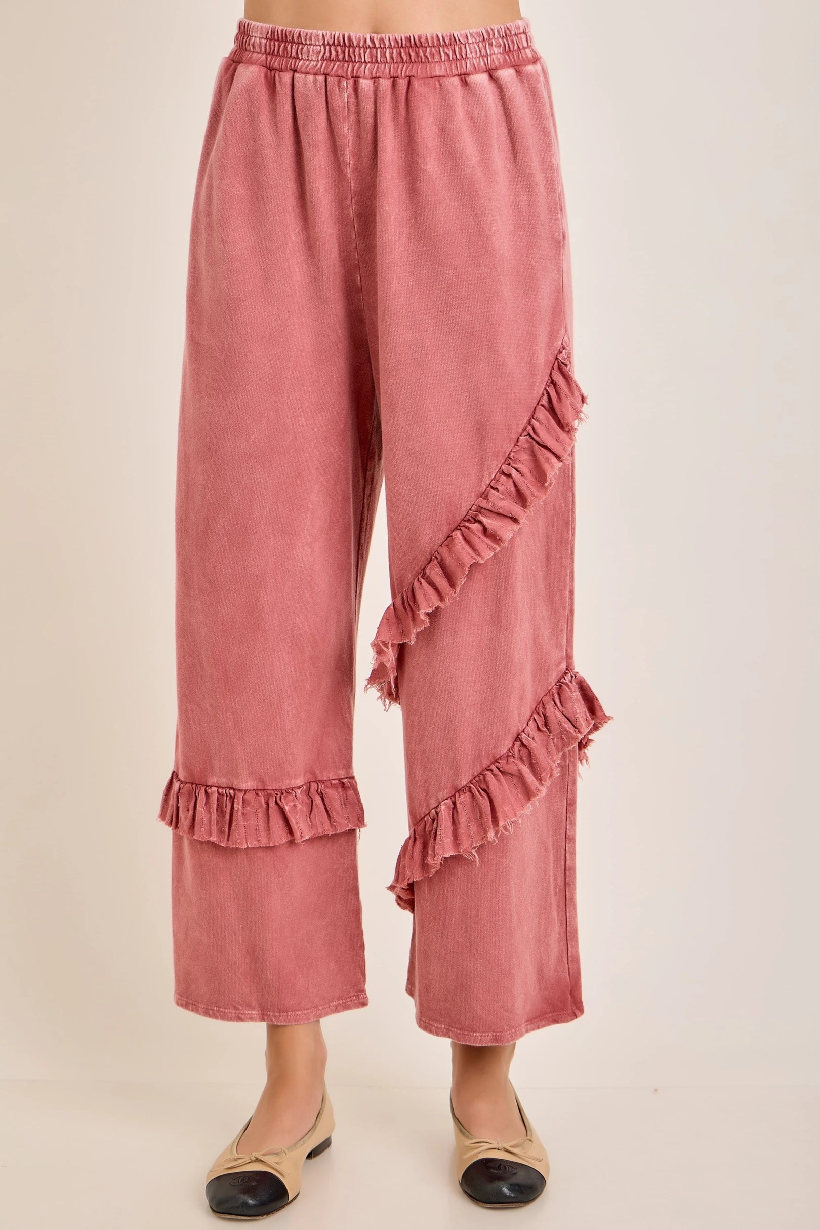 J.Her mineral washed ruffle pants front view showing diagonal ruffle detail