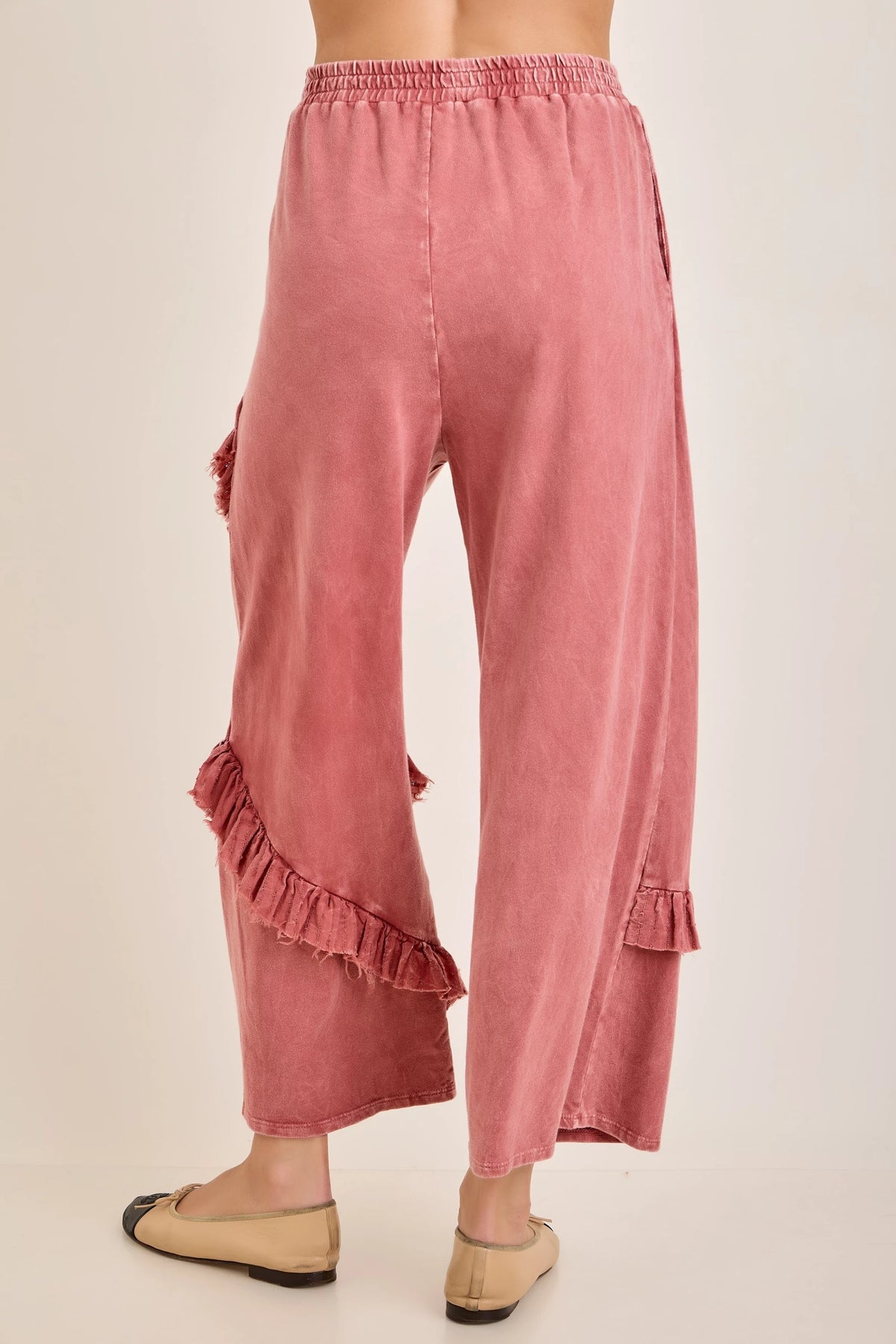 J.Her mineral washed ruffle pants back view showing ruffle hem detail