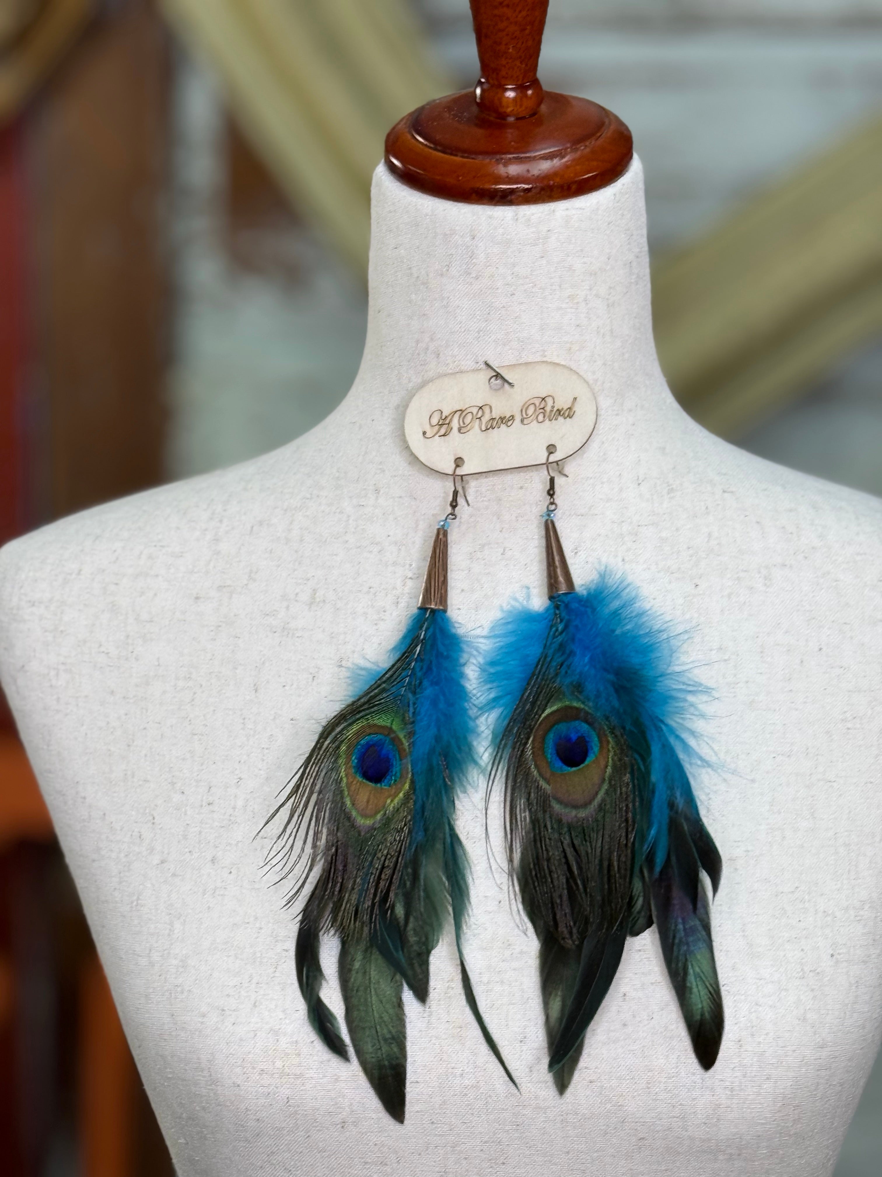 A RARE BIRD PEACOCK BLUE FEATHER EARRINGS