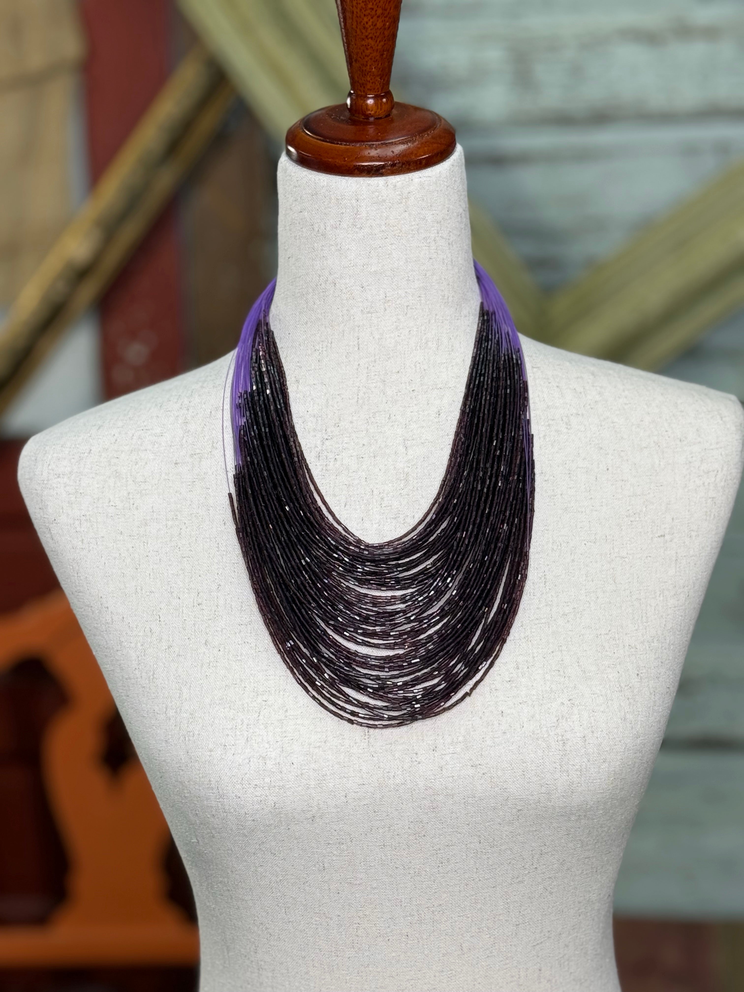 Purple multi strand bead necklace