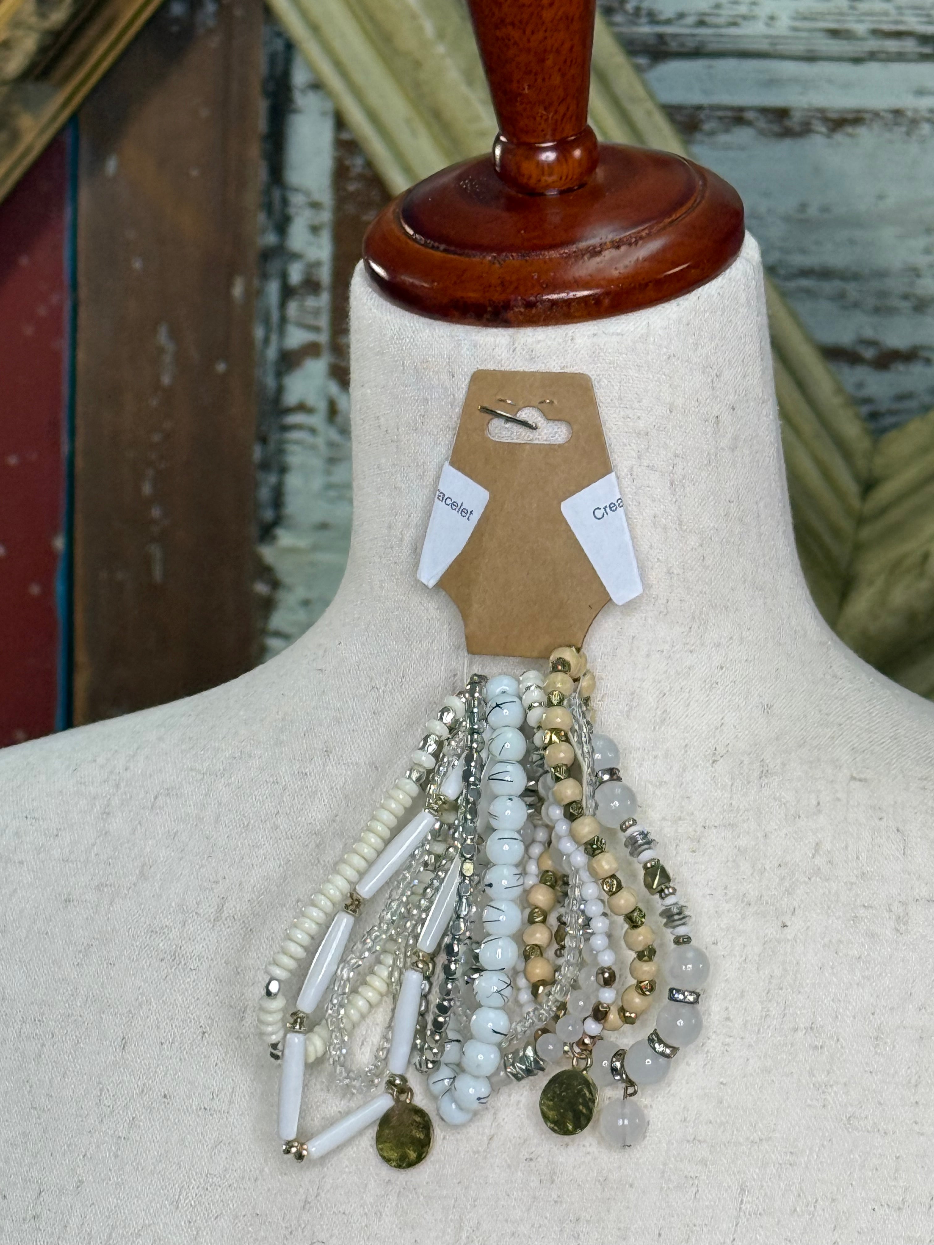 Cream and white multi strand bracelet