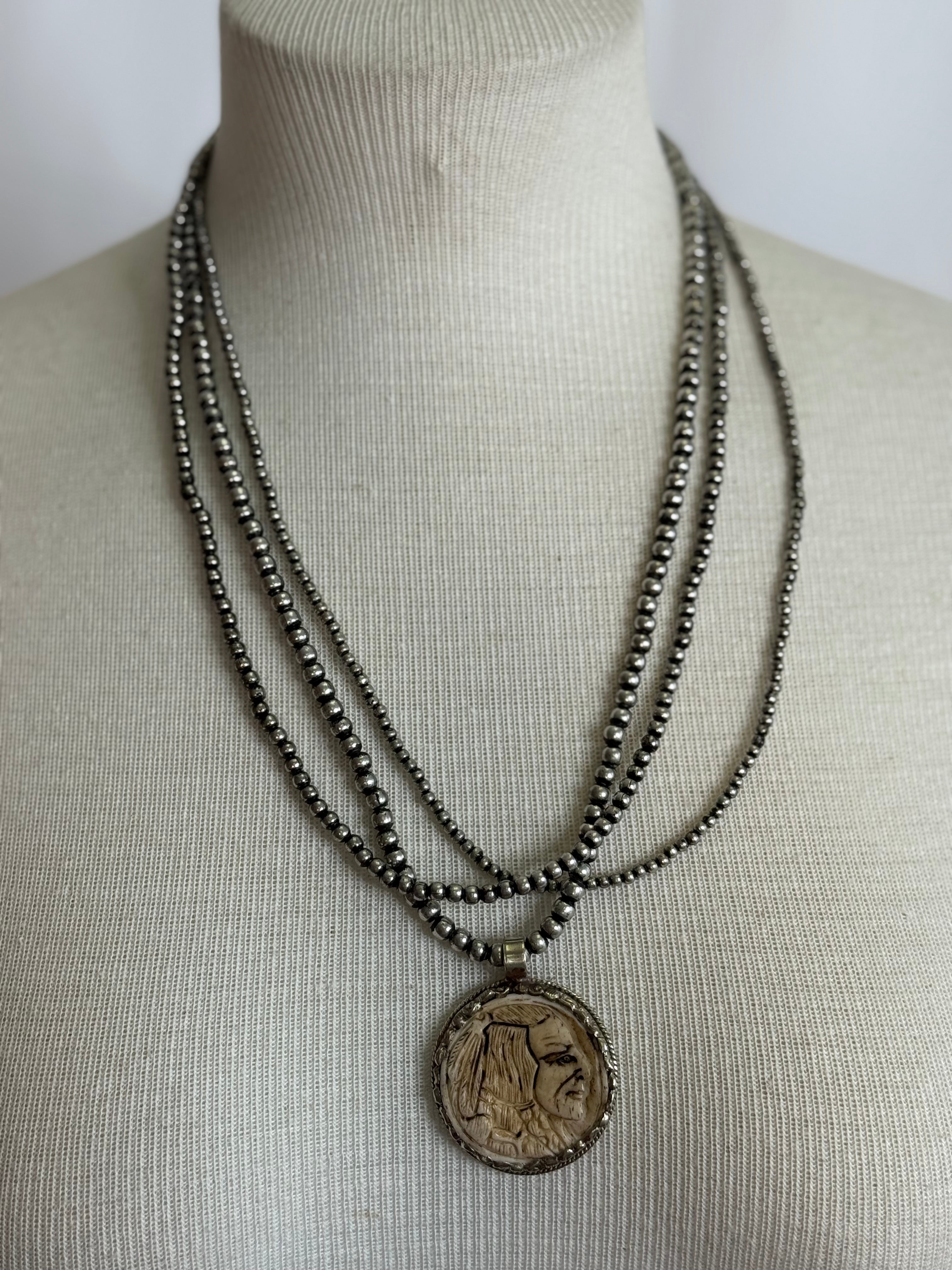 A Rare Bird Indian Head buffalo necklace