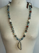 A Rare Bird Blue bead and bone feather Necklace