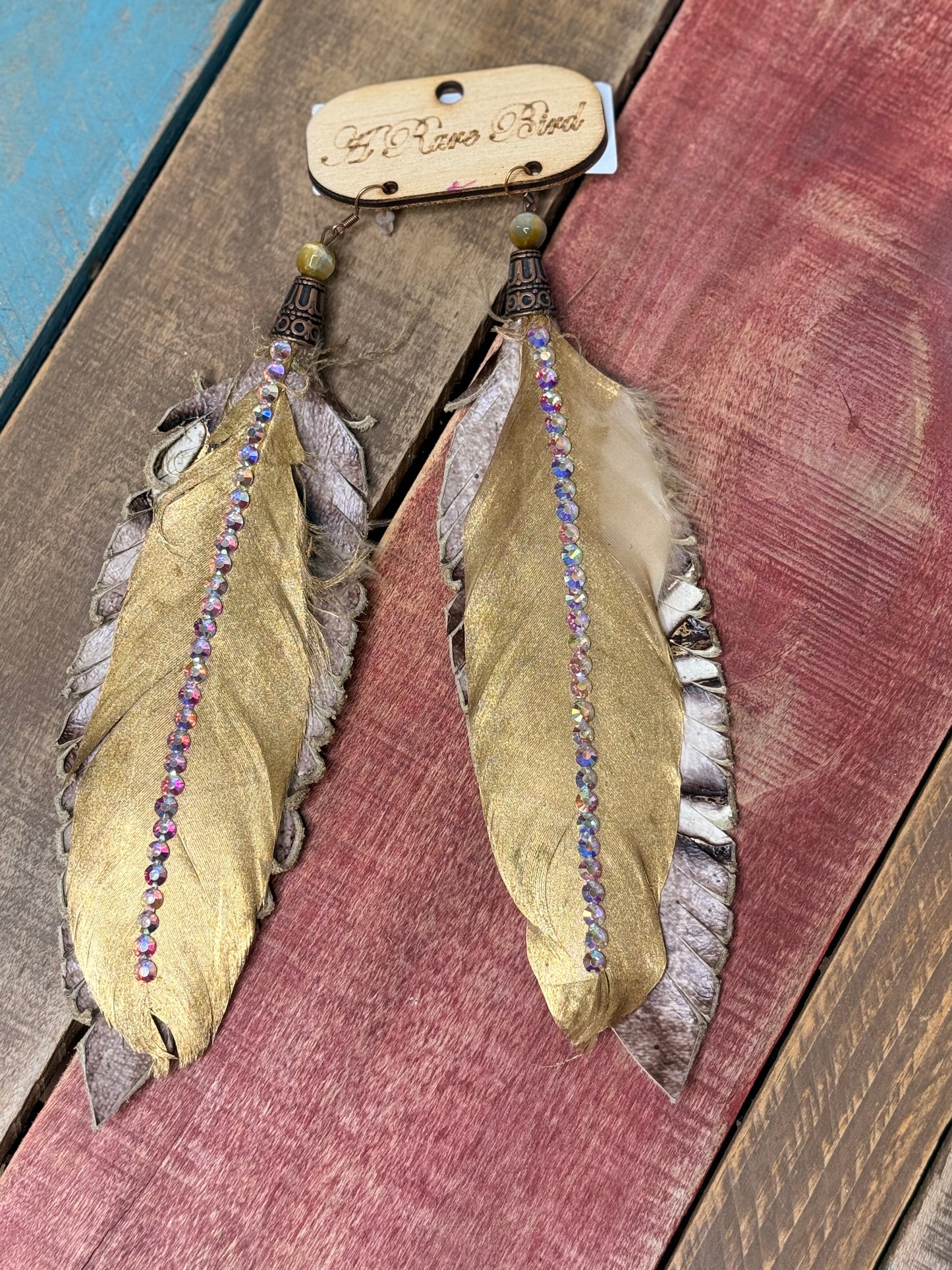 A Rare Bird Gold Leather Feather earrings