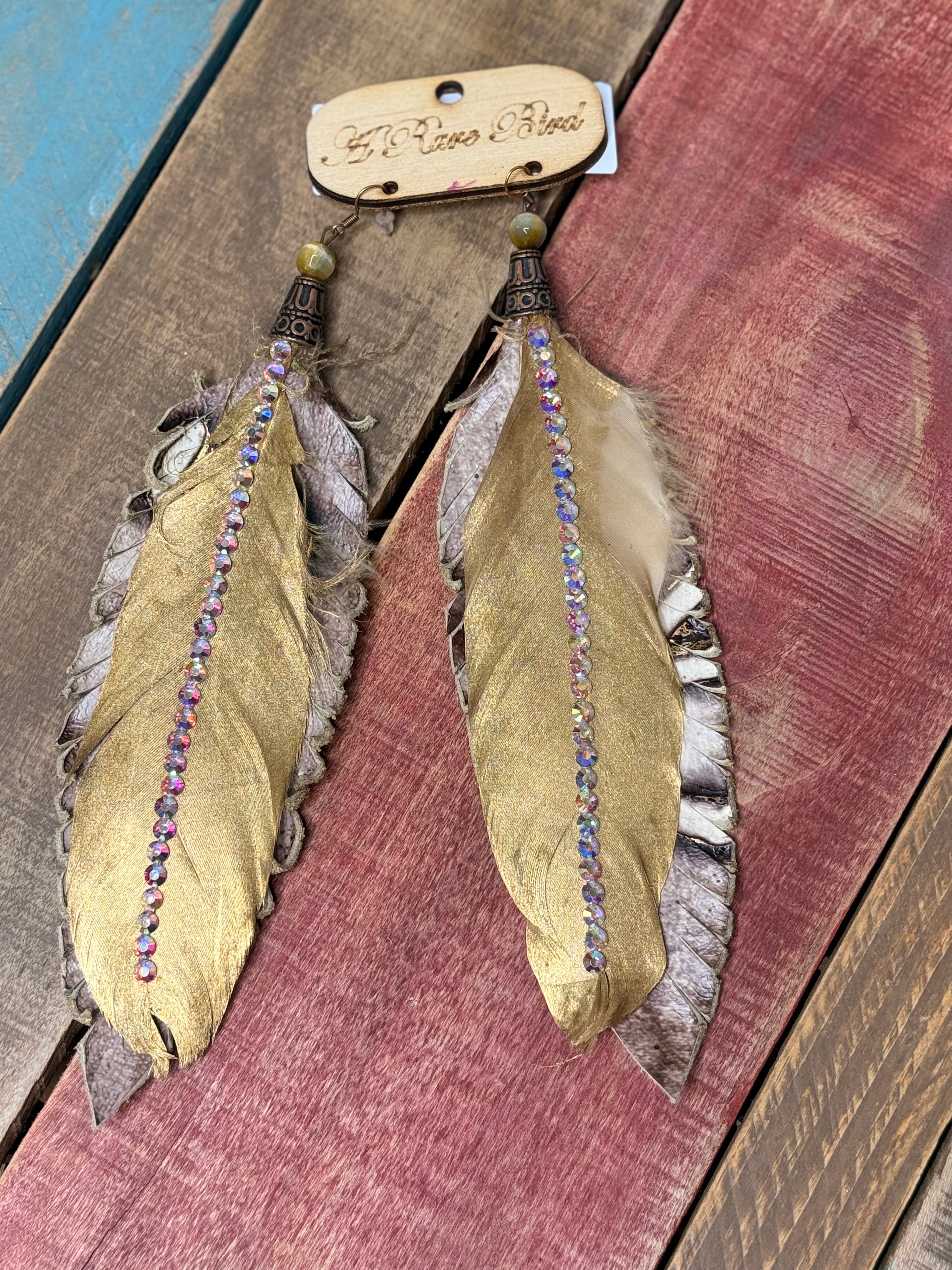 A Rare Bird Gold Leather Feather earrings