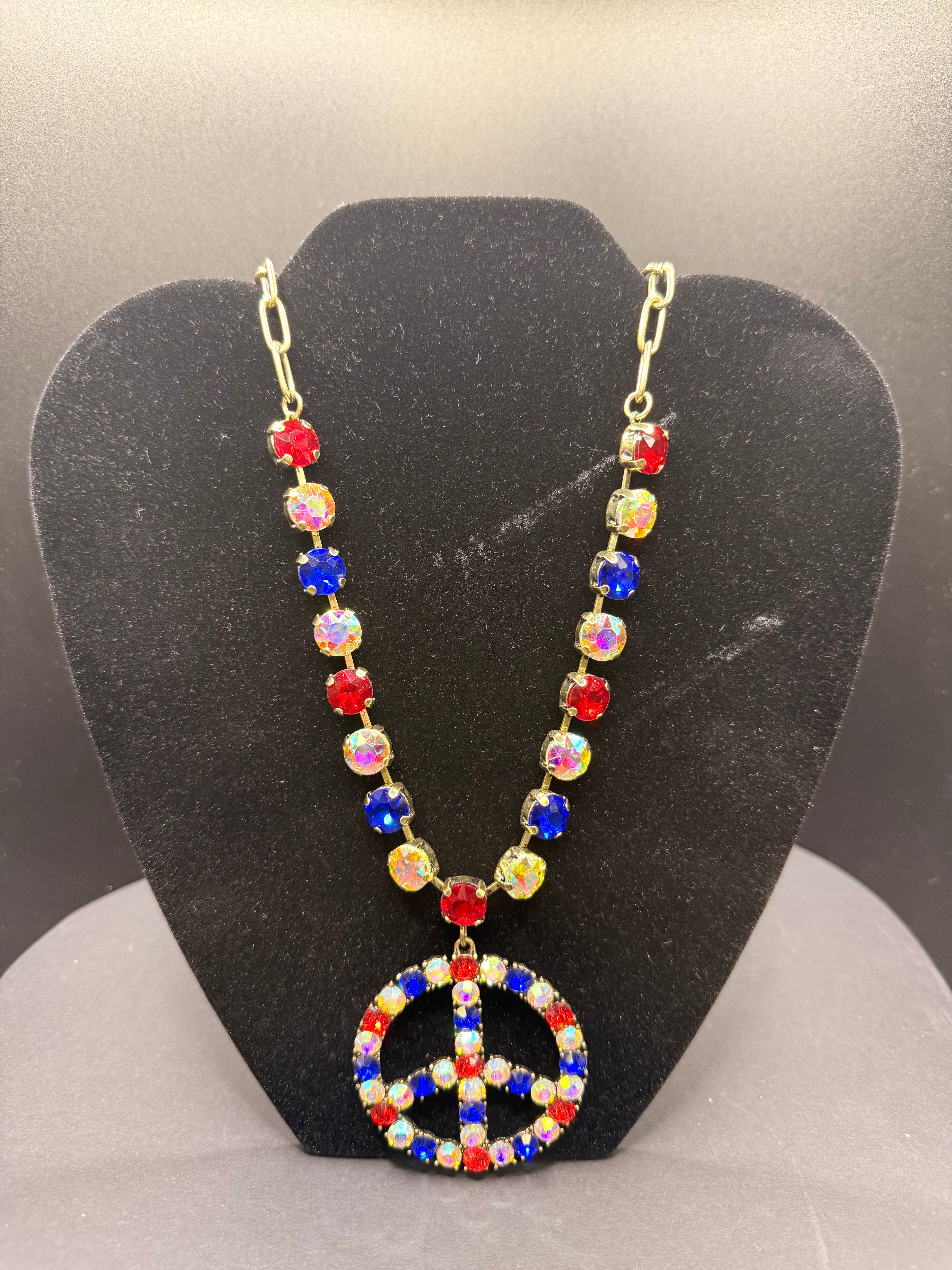 Alice gold/red, white and blue crystal peace symbol necklace