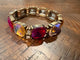 Alice Berry Glow stretch bracelet with fuchsia and iridescent champagne cushion-shaped stones in gold-tone settings