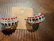 Alice holiday hoop earrings with red, green and clear round stones in a wide silver-tone setting