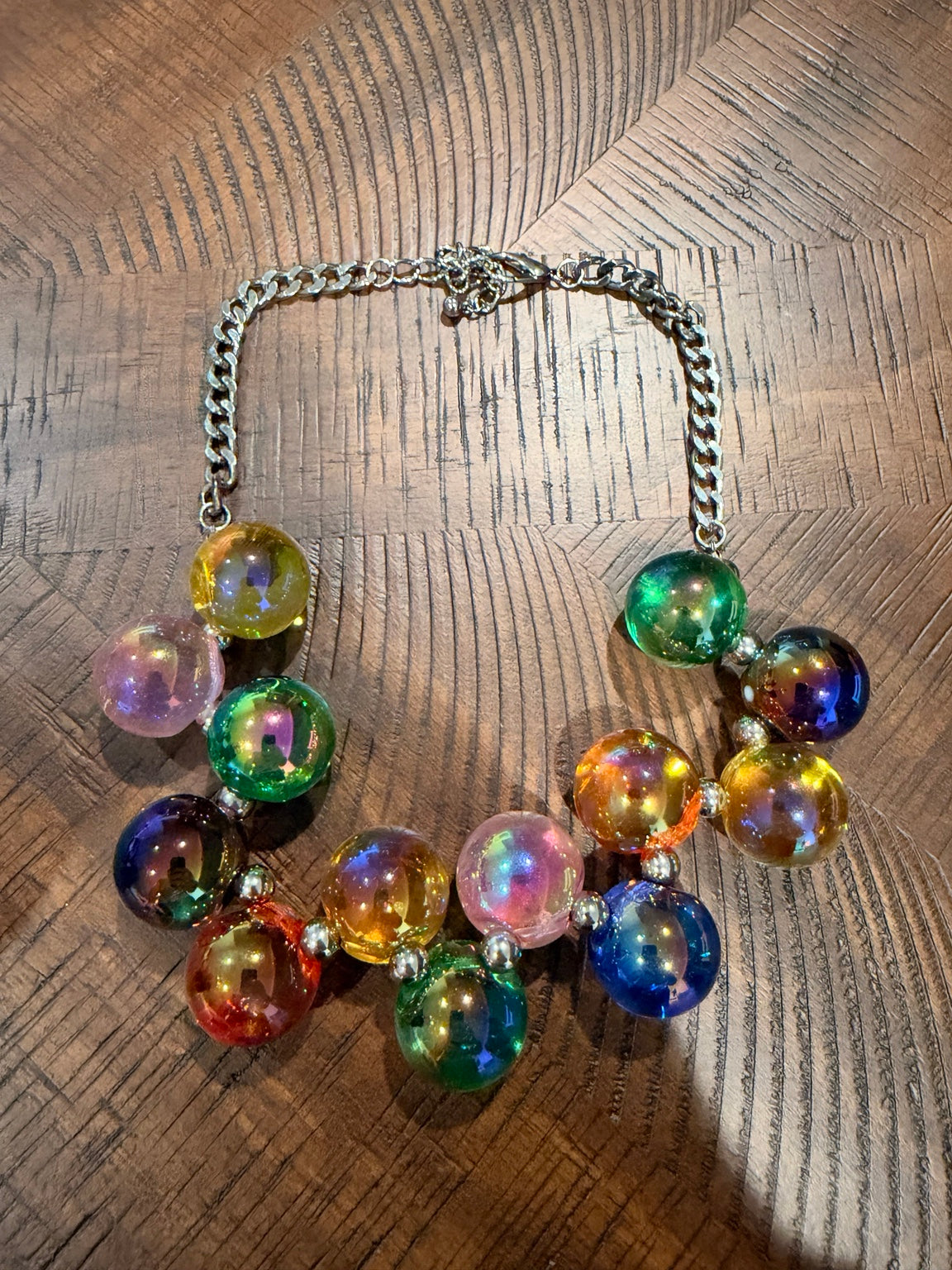 Multicolor iridescent bubble bead necklace with silver-tone chain, clasp at top