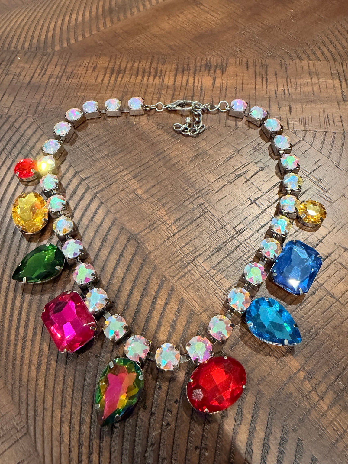 Iridescent crystal necklace with multicolor dangling stones in silver-tone settings