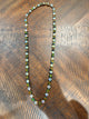 Alice necklace with alternating iridescent and dark rainbow round stones, clasp at top