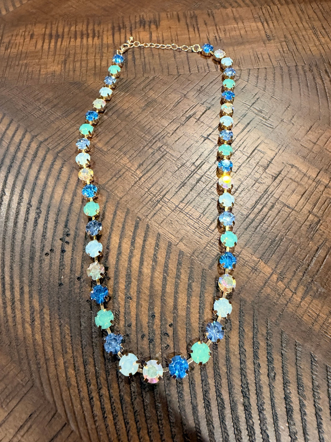 Blue, aqua and opal-look round crystal necklace in gold-tone settings