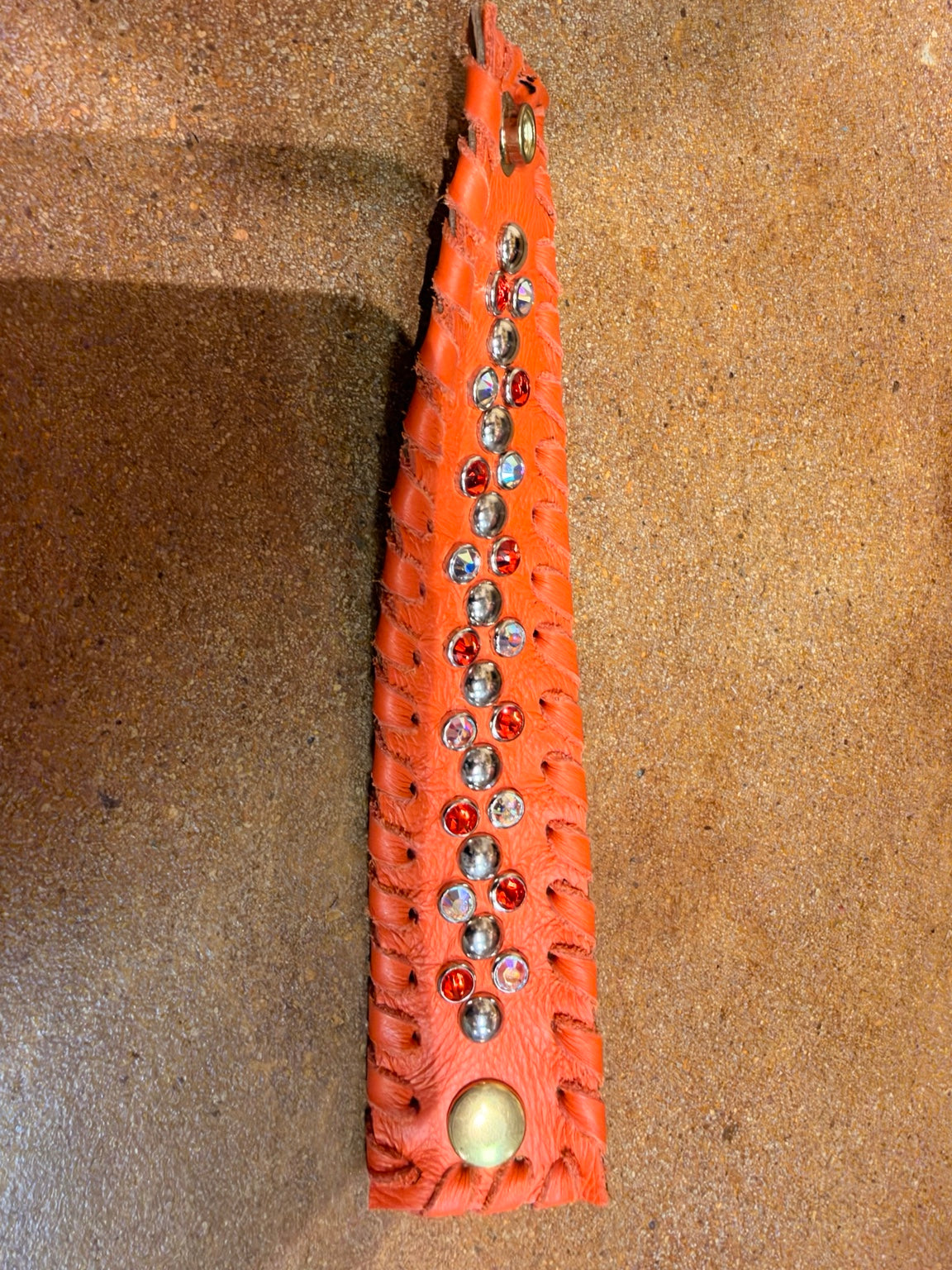 Kurtman embellished snap cuff Orange / Iridescent