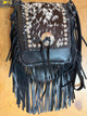 Kurtman Midnight Maverick fringe bag with mottled black and white flap, silver-tone conchos and long black fringe