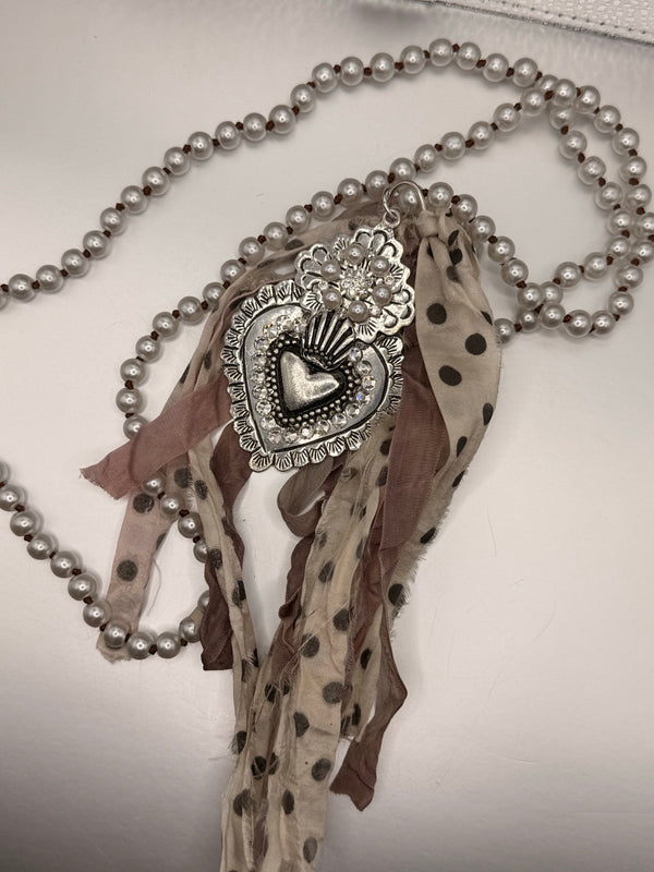 A Rare Bird Heart And Pearl Necklace