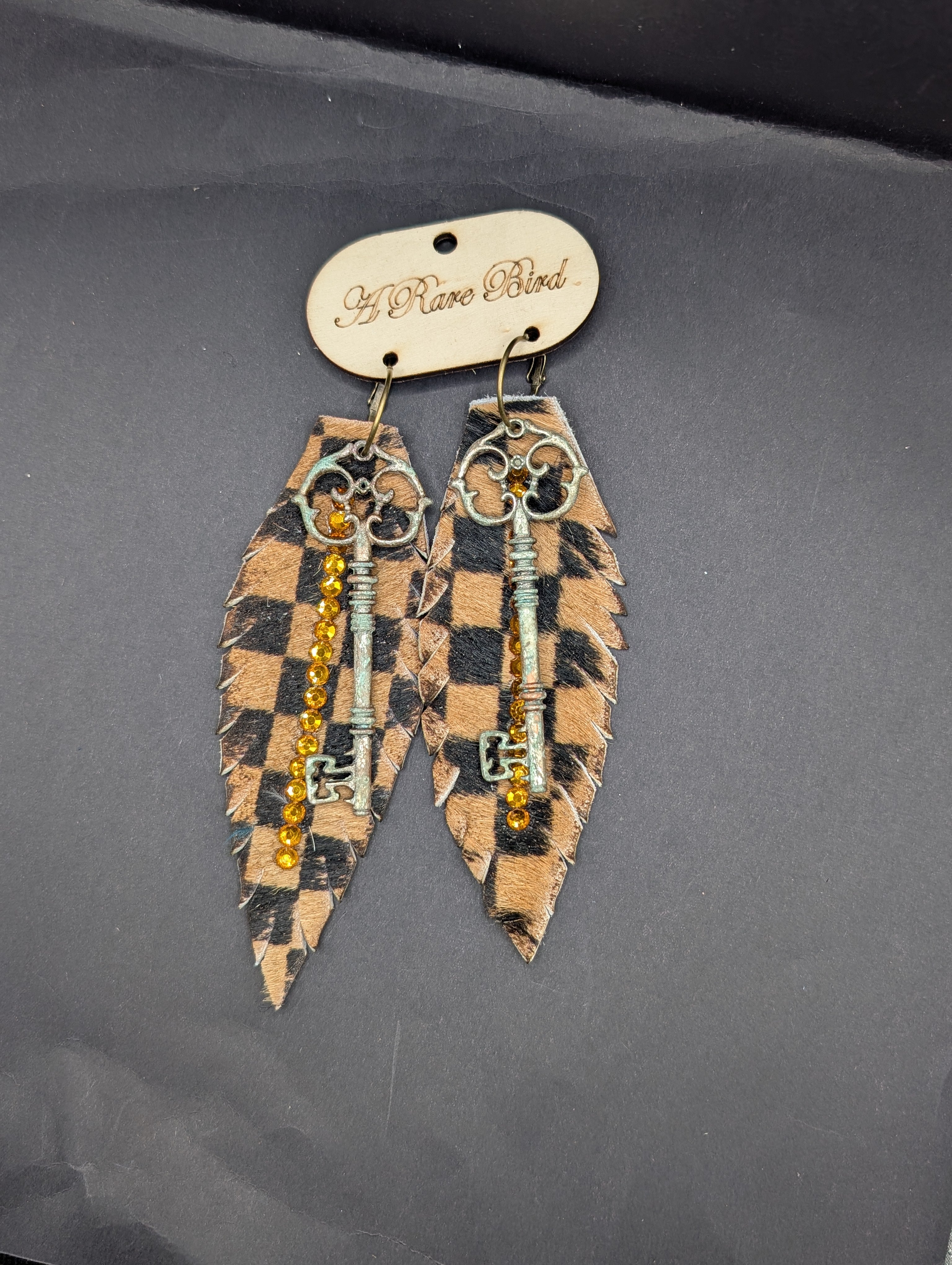 A Rare Bird Leather Feather Key Earings