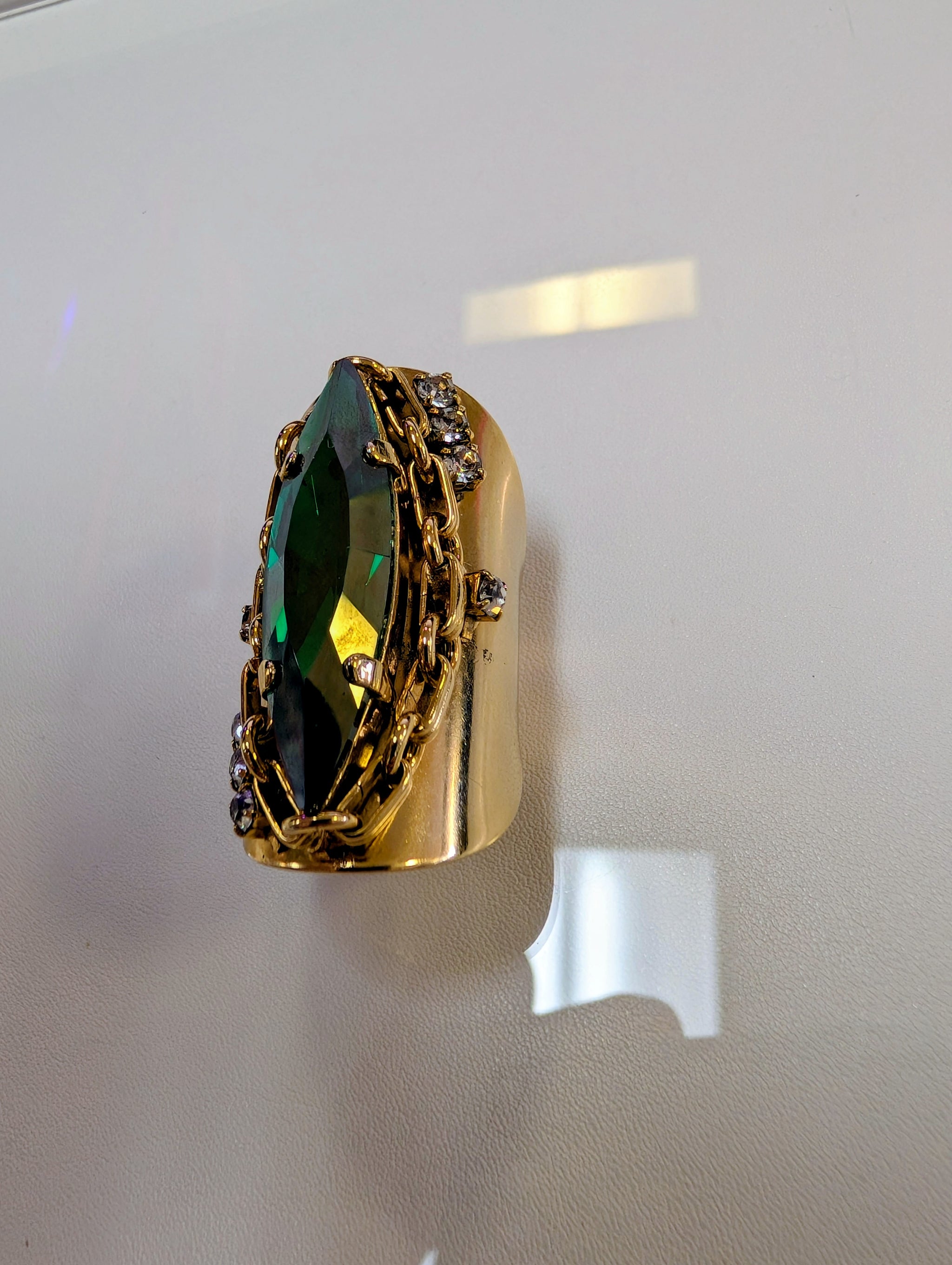 Tova Navi Ring emerald crystal gold chain statement ring - side view