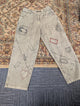 Pre Order PLG-117P light grey acid wash jeans with artisan embroidered patch details safety pin motifs and stitched heart