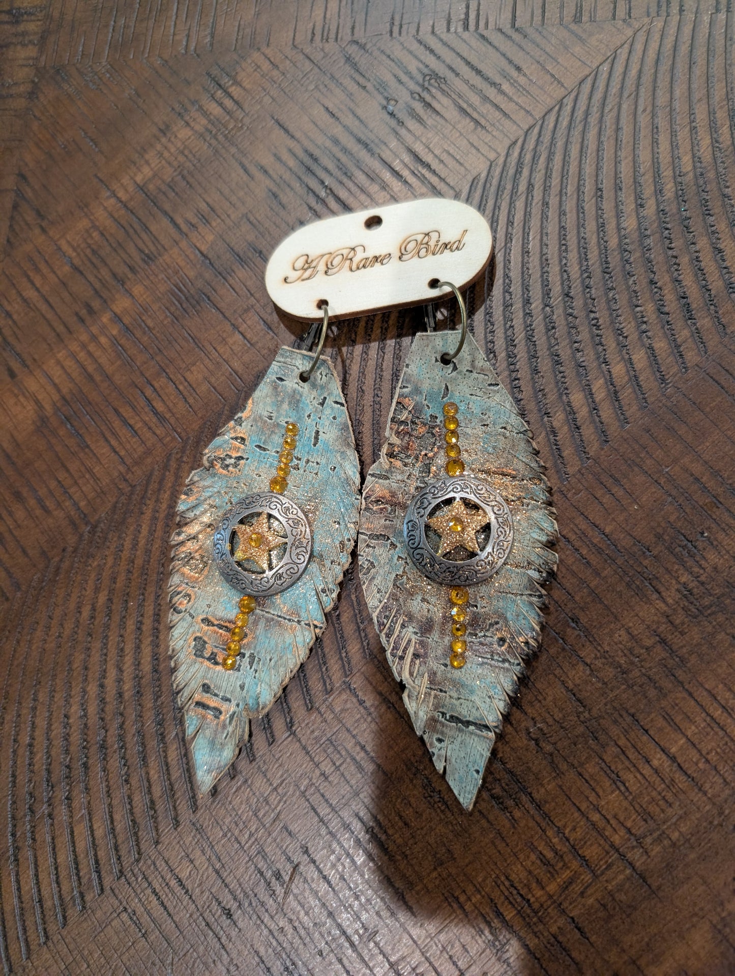 A Rare Bird Teal Cork & Gold Star Concho Feather Earrings