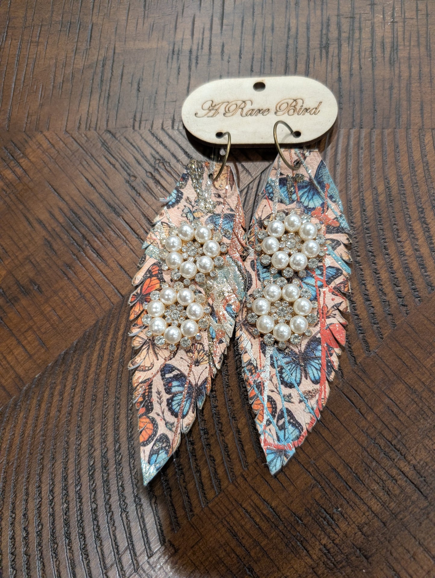 A Rare Bird Butterfly Pearl Brooch Feather Earrings on branded wooden card
