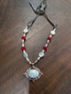A Rare Bird Pearl Rose Carved Mother of Pearl Pendant Necklace with suede tie closure