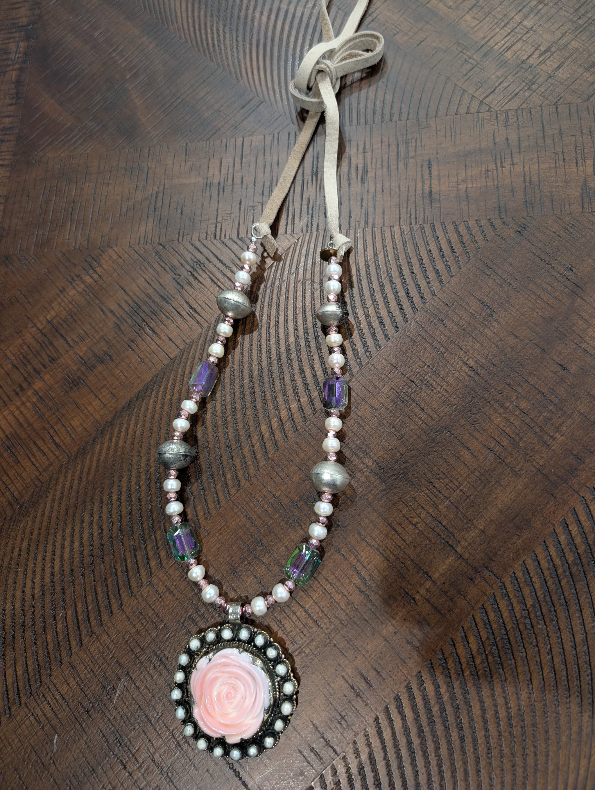 A Rare Bird Blush Rose Cameo Pearl and Crystal Pendant Necklace with suede tie closure