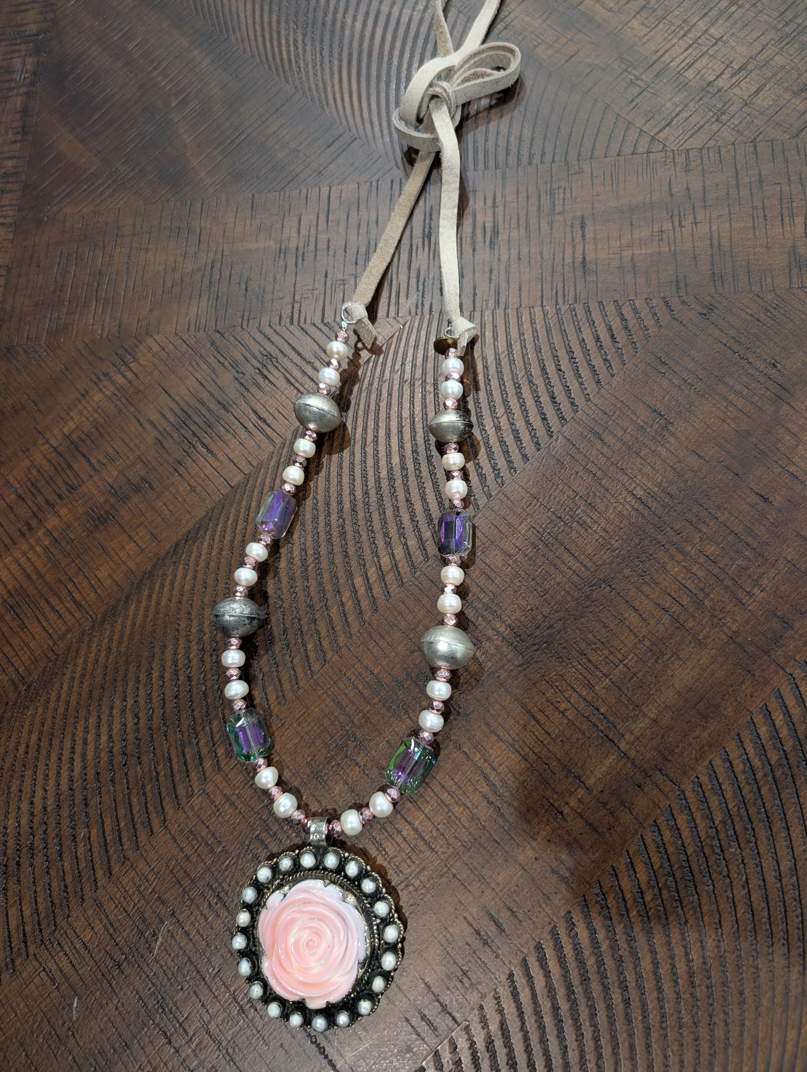 A Rare Bird Blush Rose Cameo Pearl and Crystal Pendant Necklace with suede tie closure