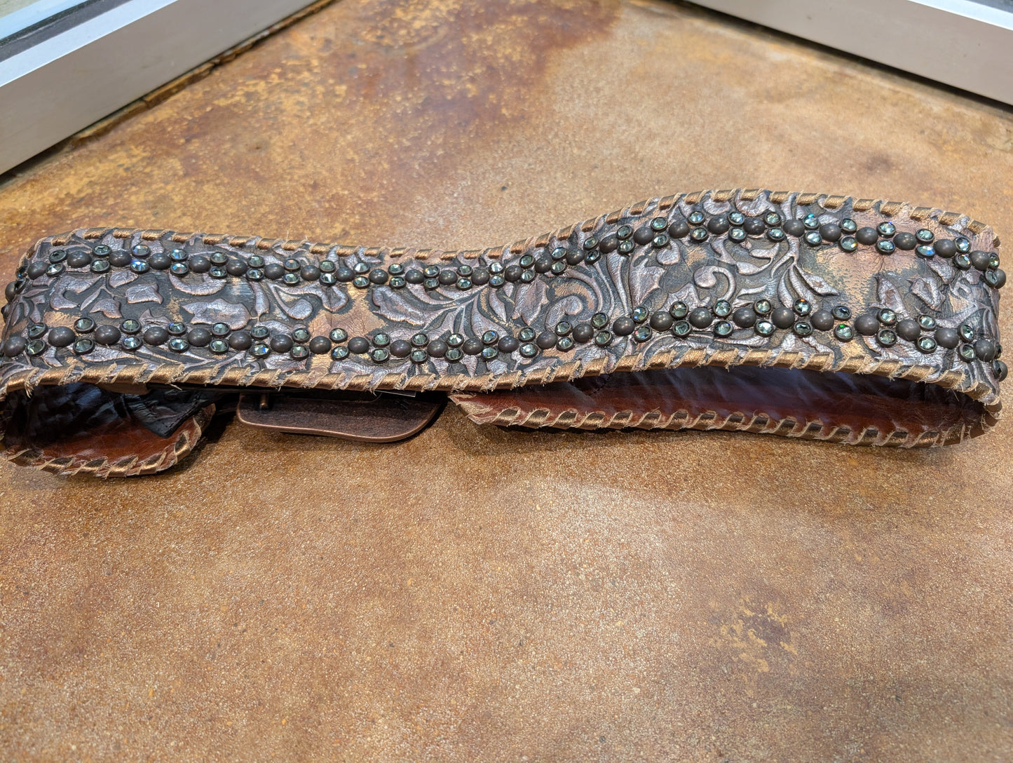 Kurtman Tooled Crystal Leather Belt — back detail showing hand-tooled floral leather and crystal stud pattern