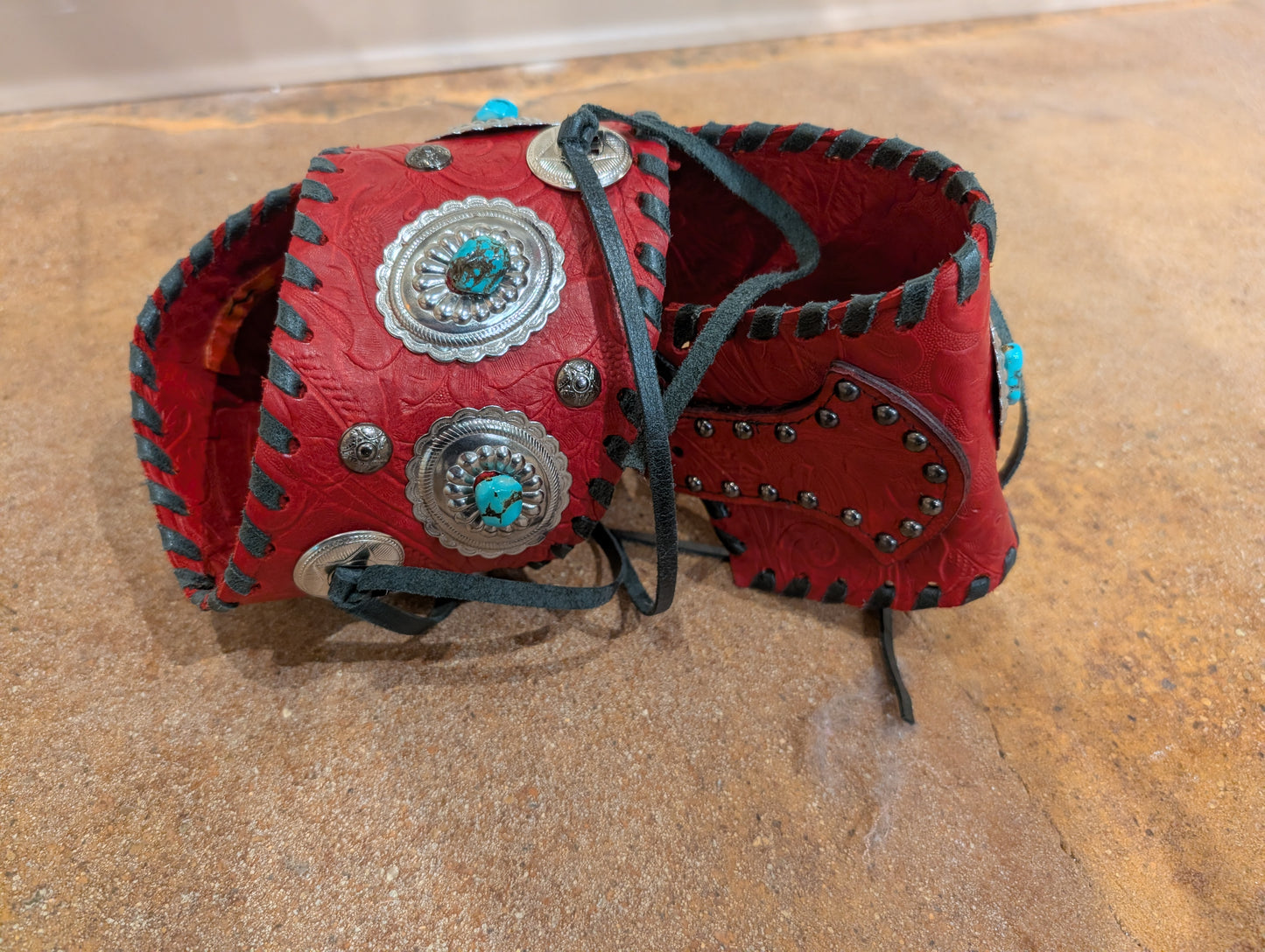 Kurtman Red Tooled Concho Corset Belt — back detail showing full concho layout and black whipstitch