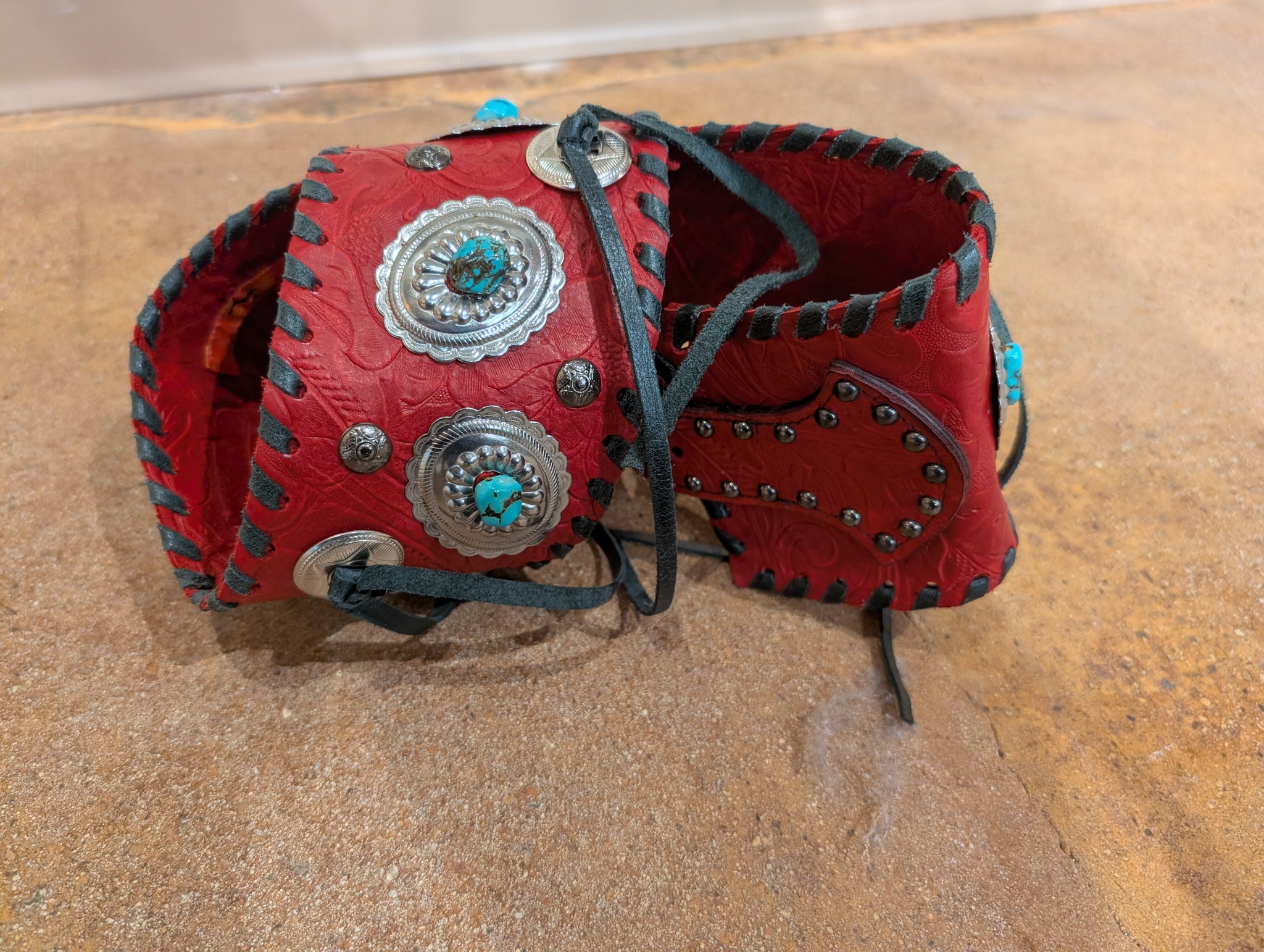 Kurtman Red Tooled Concho Corset Belt — back detail showing full concho layout and black whipstitch