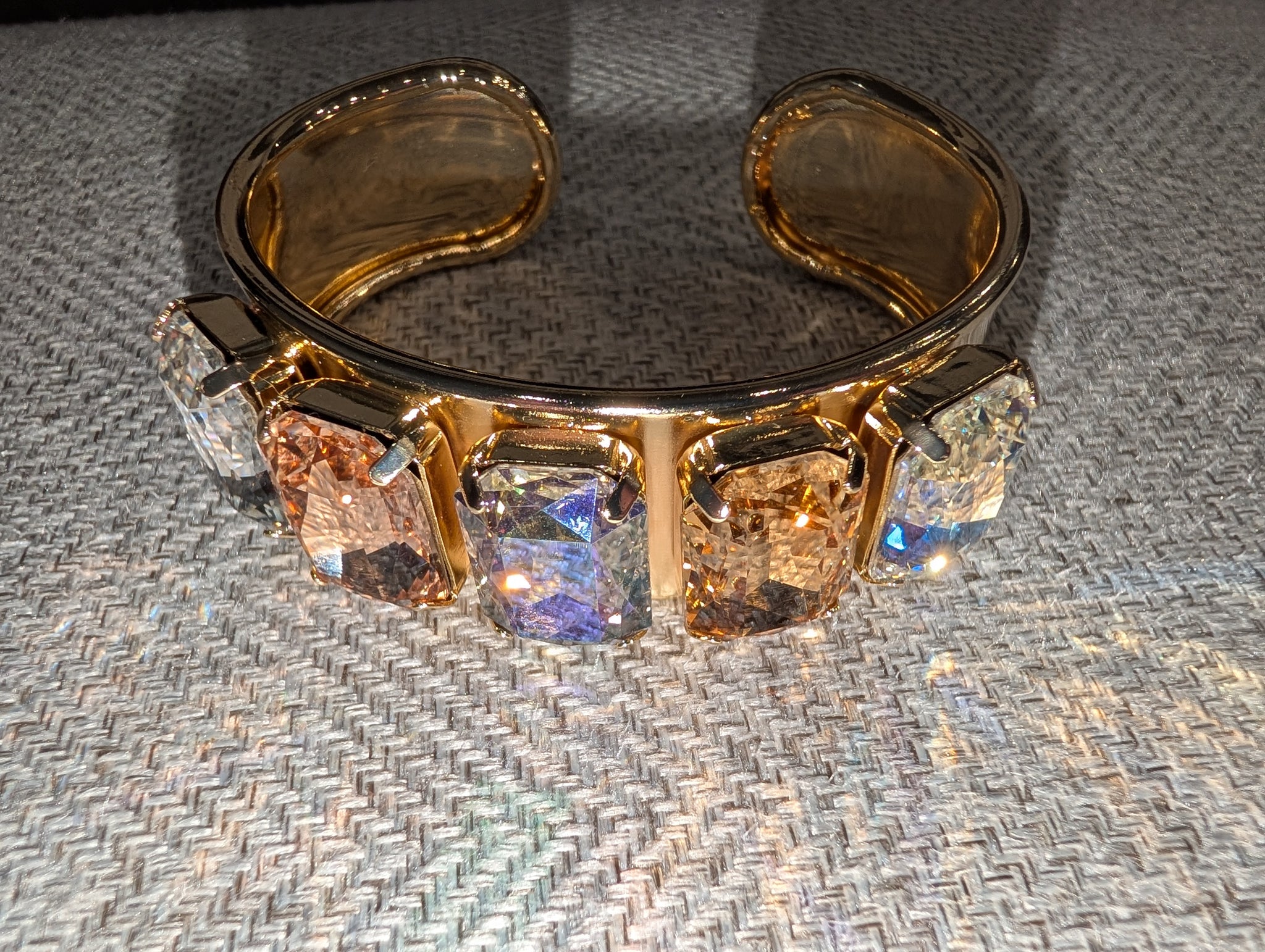 Pre Order WaFa 5-Stone Crystal Cuff Bracelet — volcano: five mixed champagne, blush AB, and iridescent cushion-cut crystals in gold prong settings on wide gold cuff