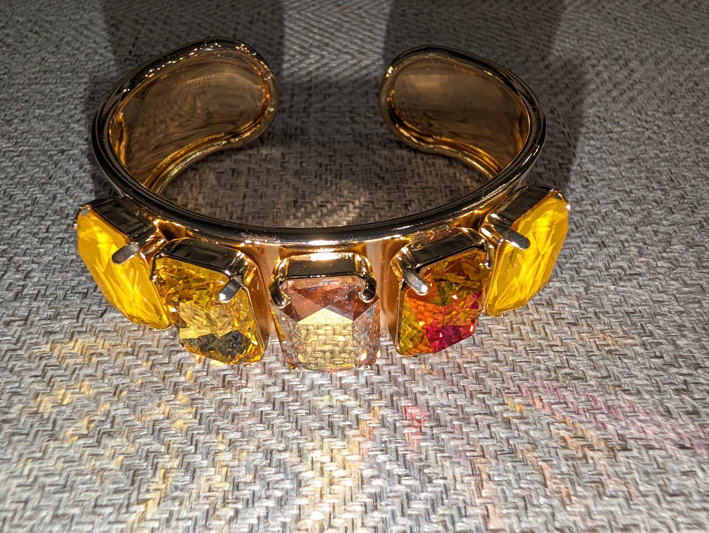 Pre Order WaFa 5-Stone Crystal Cuff Bracelet — citrus: five mixed neon yellow, amber, and red cushion-cut crystals in gold prong settings on wide gold cuff