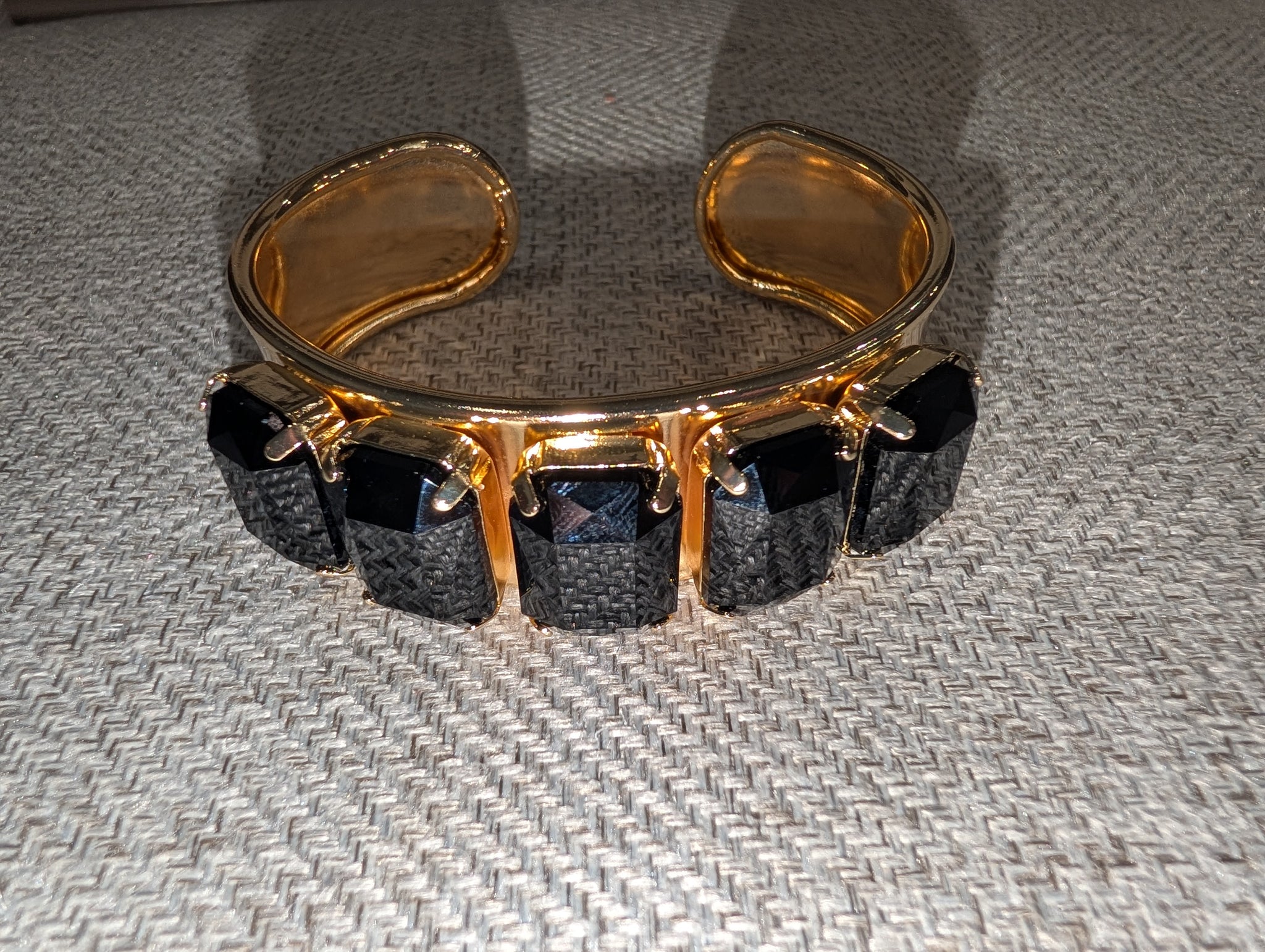 Pre Order WaFa 5-Stone Crystal Cuff Bracelet — black: five jet black cushion-cut crystals in gold prong settings on wide gold cuff