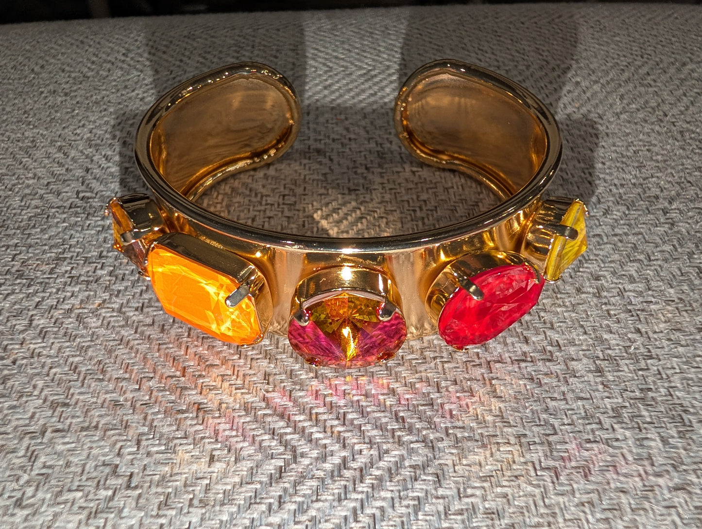 Pre Order WaFa 3-Stone Mixed Crystal Cuff Bracelet — neon orange: hot pink/orange round center with orange cushion and red marquise flanks on wide gold cuff