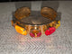 Pre Order WaFa 4-Stone Mixed Crystal Cuff Bracelet — neon orange: orange cushion, hot pink rivoli center, red oval, and neon yellow marquise on wide gold cuff
