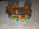 Pre Order WaFa 4-Stone Mixed Crystal Cuff Bracelet — green: teal marquise, green AB rivoli center, green AB oval on wide gold cuff