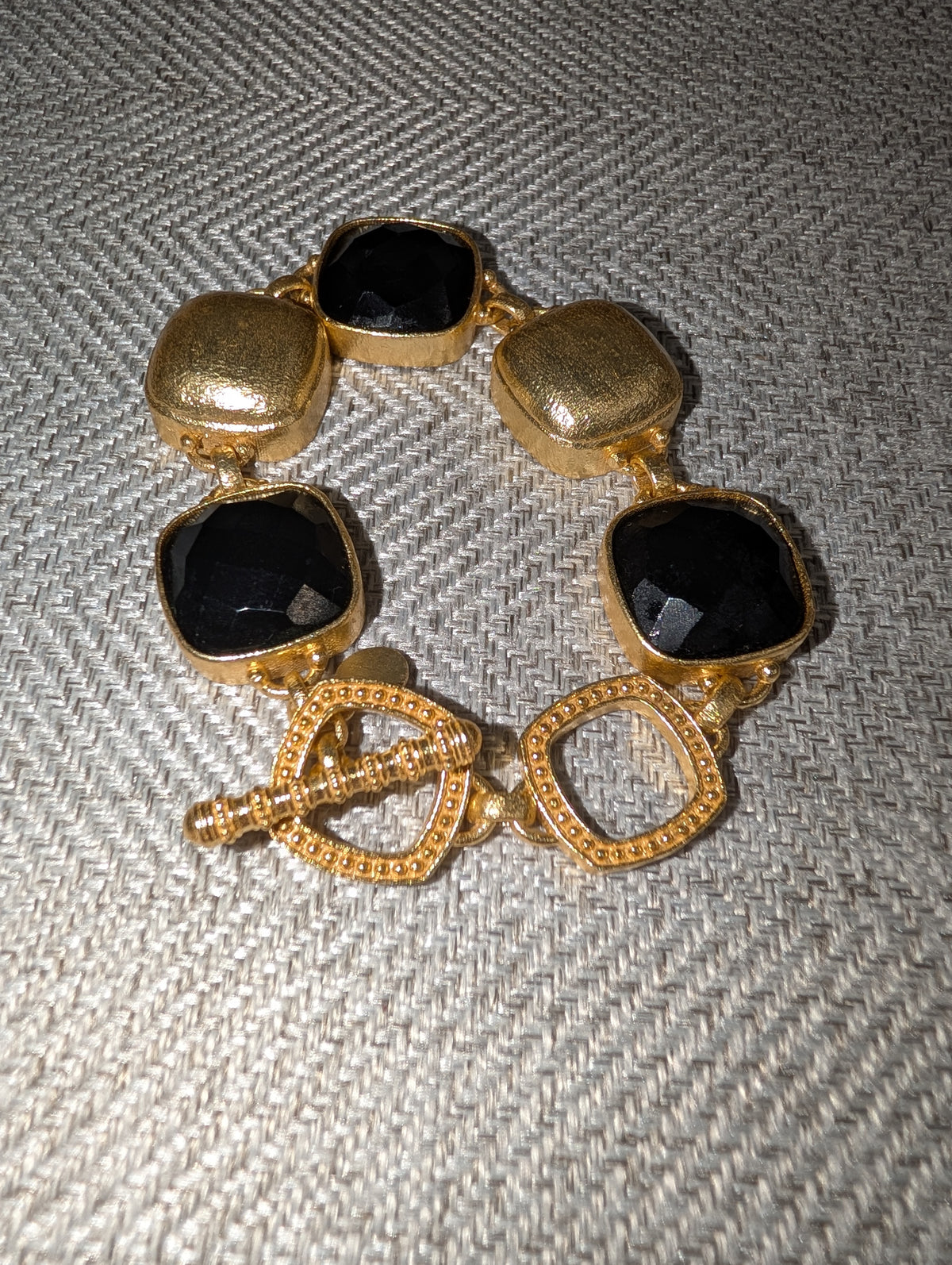 Pre Order WaFa Black Cushion Crystal Hammered Gold Toggle Bracelet — oversized faceted black cushion-cut crystals in hammered gold bezel settings with decorative gold beaded toggle clasp