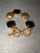 Pre Order WaFa Black Cushion Crystal Hammered Gold Toggle Bracelet — oversized faceted black cushion-cut crystals in hammered gold bezel settings with decorative gold beaded toggle clasp