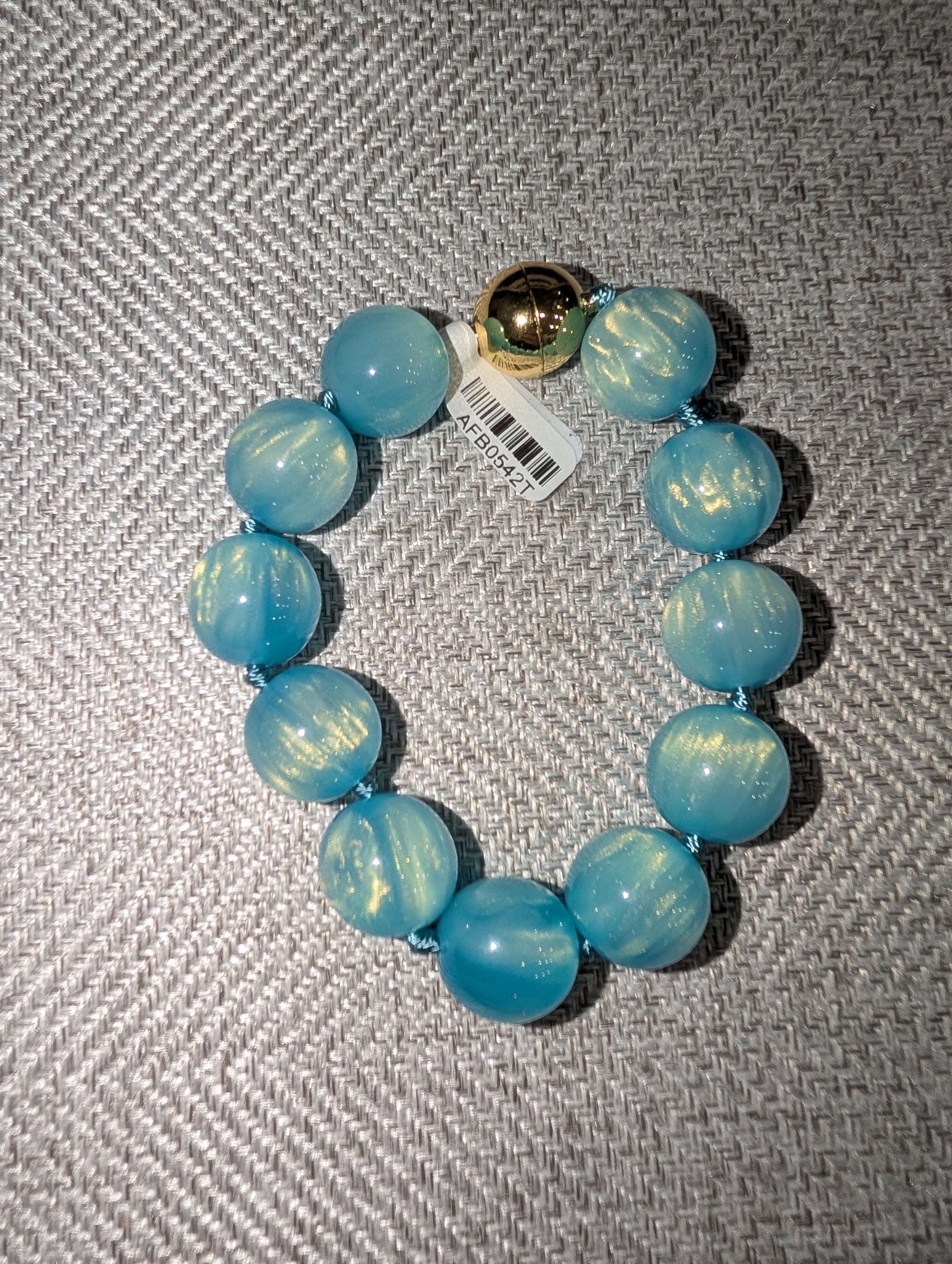 Pre Order WaFa Marbled Resin Bead Bracelet — blue: oversized opalescent sky blue resin round beads knotted on blue cord with gold magnetic ball clasp