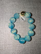 Pre Order WaFa Marbled Resin Bead Bracelet — blue: oversized opalescent sky blue resin round beads knotted on blue cord with gold magnetic ball clasp