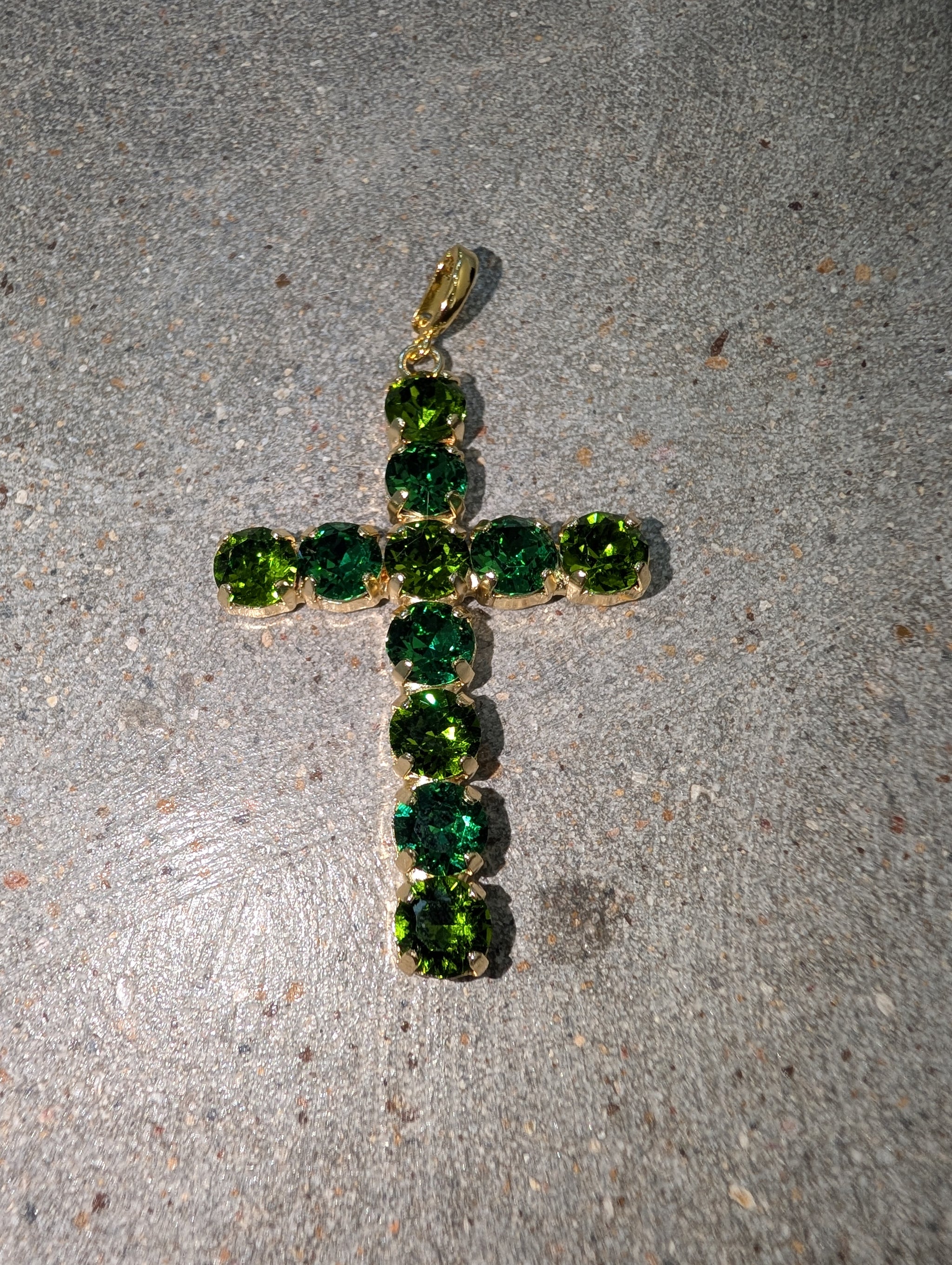 Pre Order WaFa Emerald Green Crystal Cross Pendant — oversized round faceted emerald green crystals set in gold prong cups forming a bold cross shape with gold bail