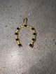 Pre Order WaFa Black Onyx Horseshoe Pendant — horseshoe-shaped pendant with alternating black onyx square cabochons in gold bezel settings and polished gold ball beads, finished with a gold bail