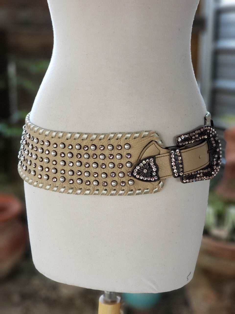 Kurtman Born to Wander cream statement belt with pearl-look accents, sparkling stones and embellished buckle