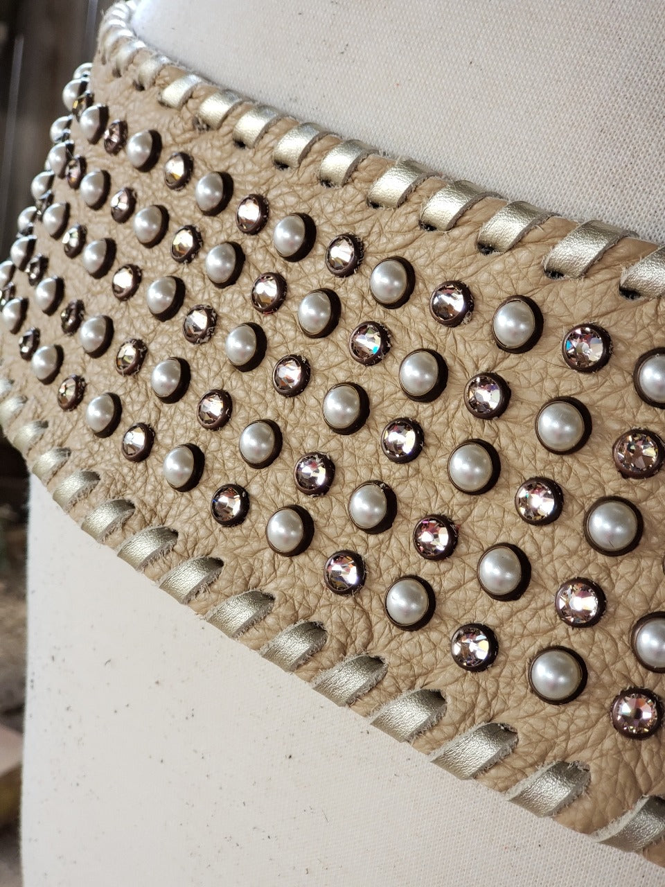 Kurtman Born to Wander cream statement belt with pearl-look accents, sparkling stones and embellished buckle