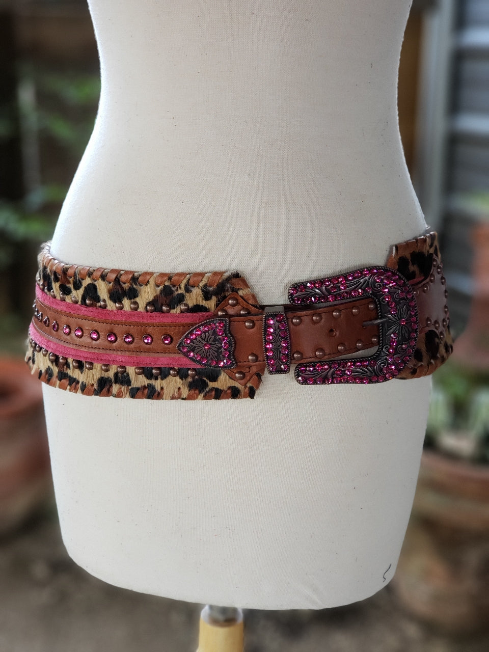 Kurtman Sassy Little Outlaw belt with leopard print, pink trim, brown studded strap and sparkling pink Western buckle
